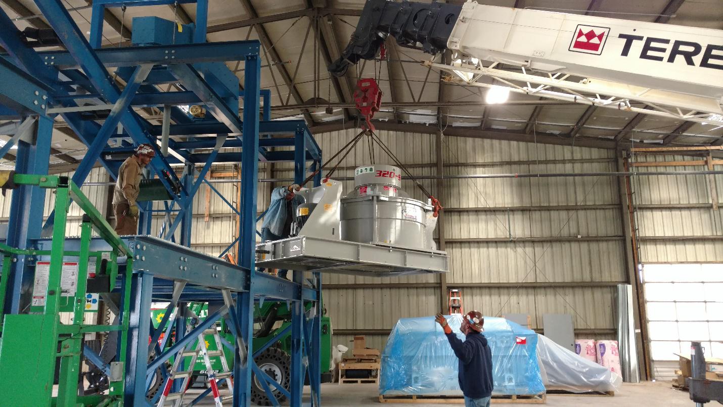 Grinder lowered into place, Momentum Recycling