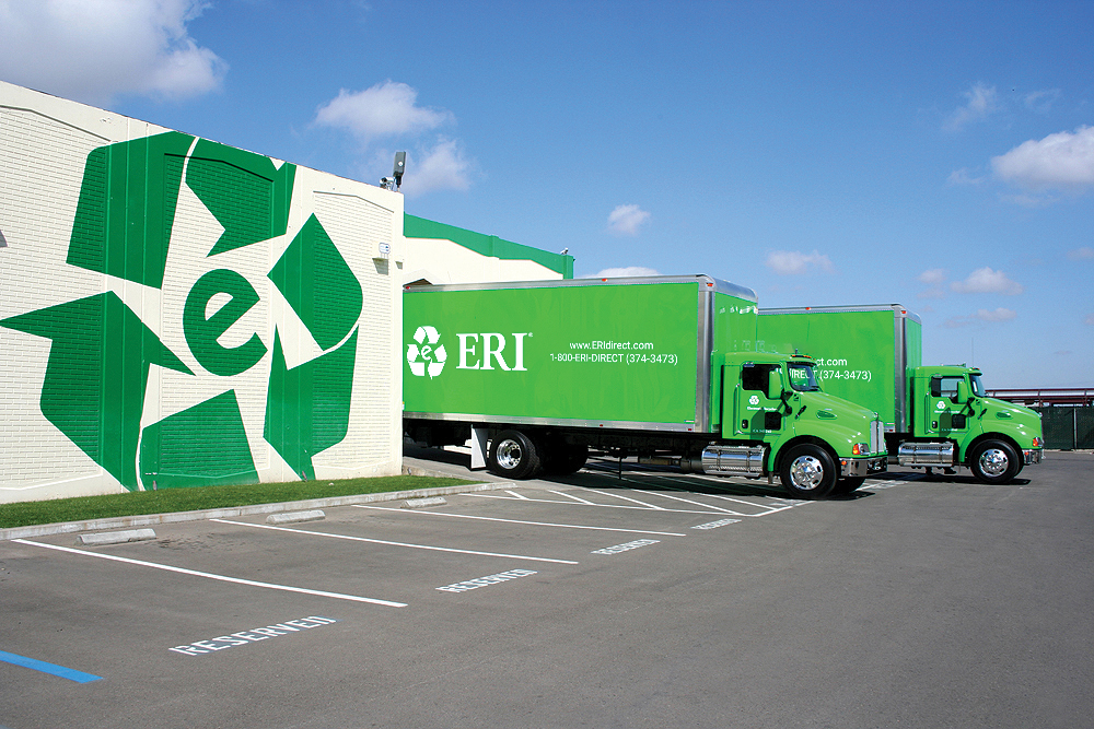 Exterior of ERI building with trucks parked for loading.