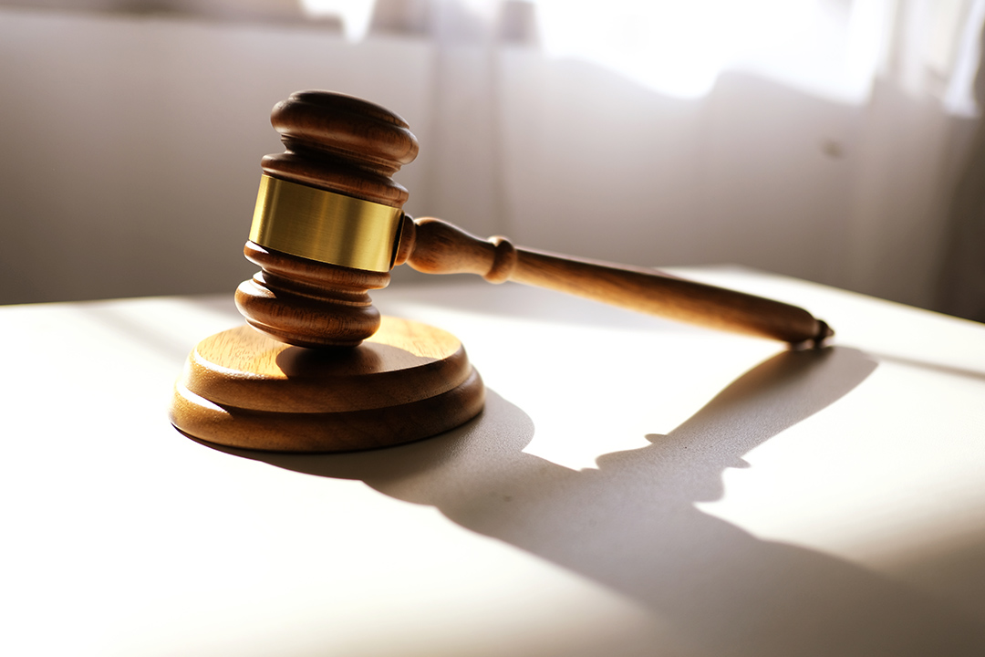 A court gavel on a desk.