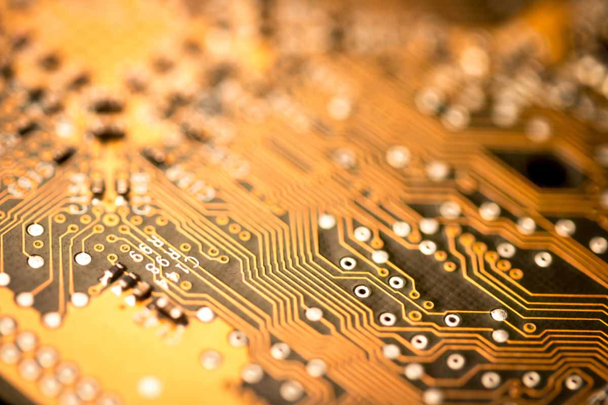 Closeup of a gold circuit board.