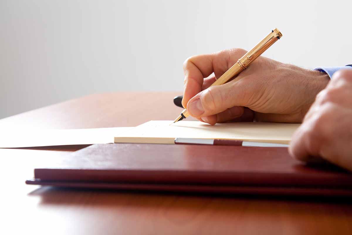 Signing business documents.