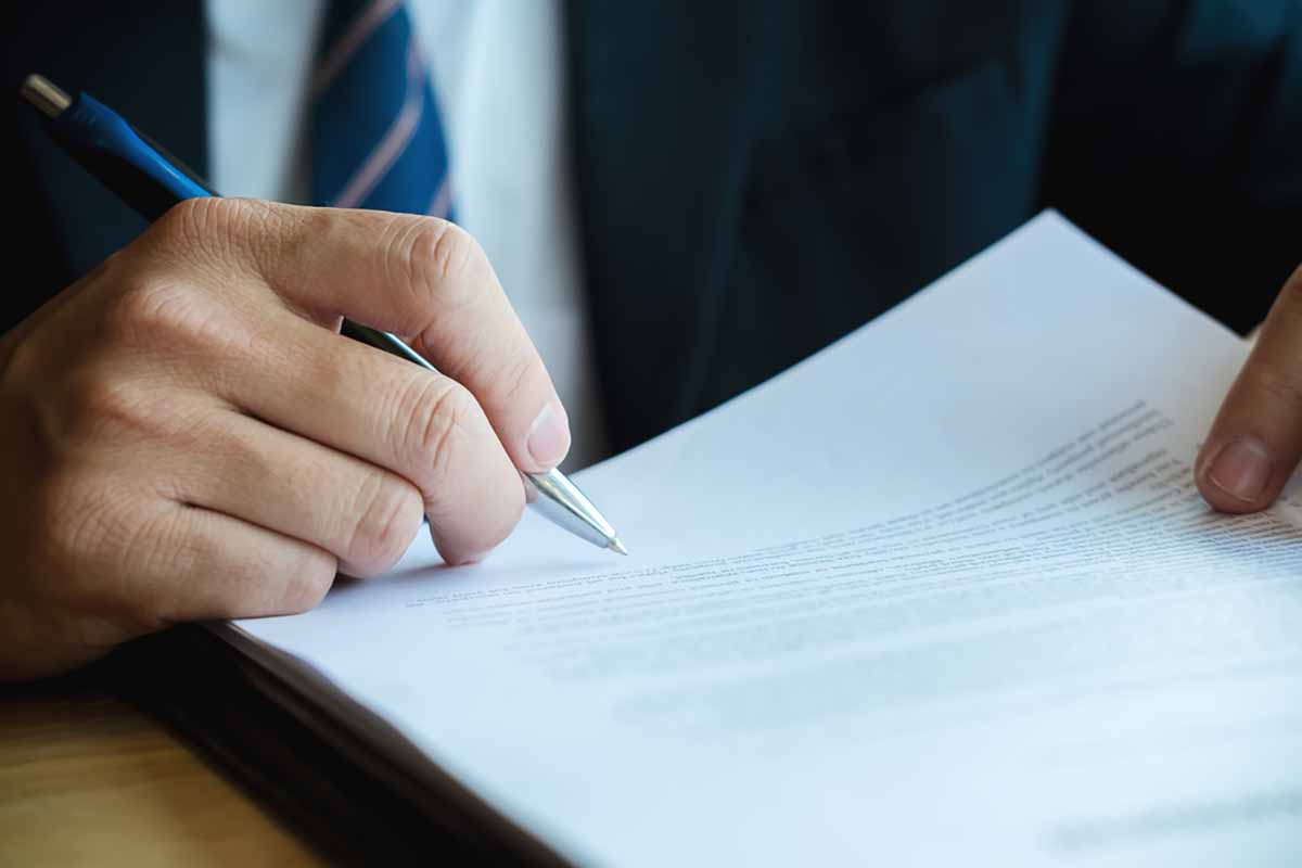 Signing business documents.