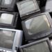 Pile of CRT televisions for recycling.