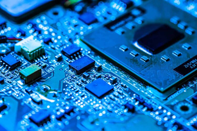 Close up of a circuitboard in blue light.