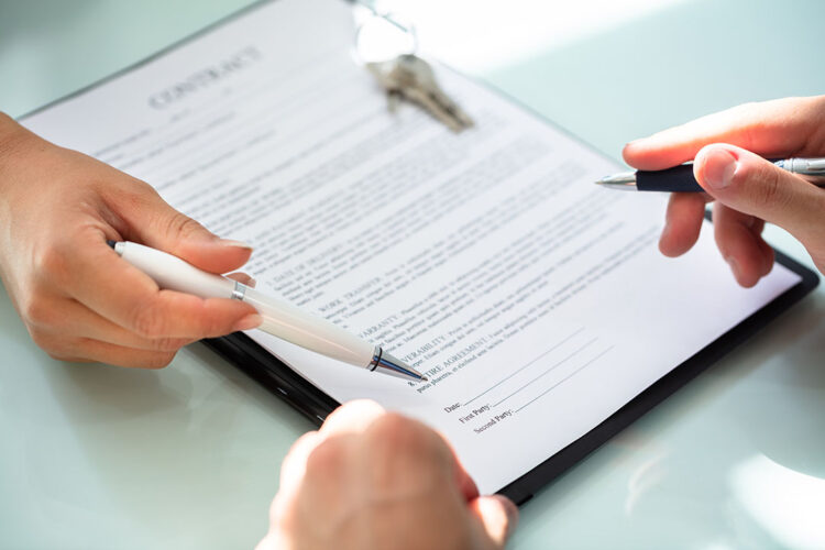 Signing a contract.