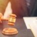 Plaintiff in processor lawsuit now facing criminal charges