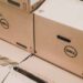 Dell computer boxes with desktop computers inside.