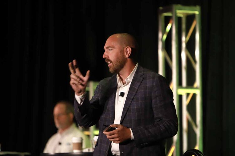 Bo Bodo of Li-Cycle speaks on stage at the 2022 E-Scrap Conference.