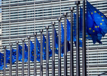 E.U. flags in front of the European Commission building.