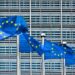 EU flags in front of the European Commission's building.