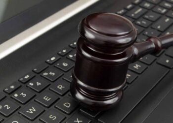 Gavel on a laptop.