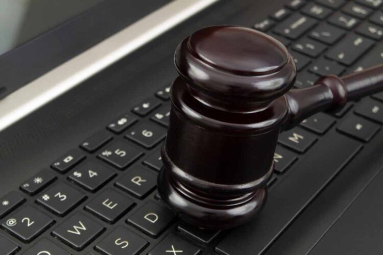 Gavel on a laptop.