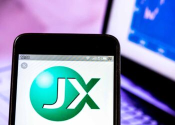 JX Nippon Mining and Metals logo on phone screen.