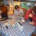 Family repairing devices before donating.Samsung
