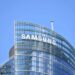 Samsung company sign on building with blue sky background.