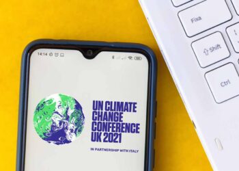 UN Climate Change Conference 2021 logo on mobile phone screen.