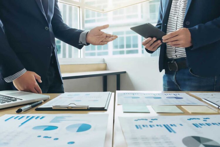 Business meeting with documents on table.