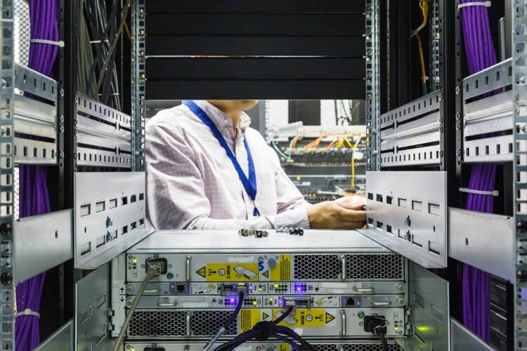 Servicing a hard disk at a data center.