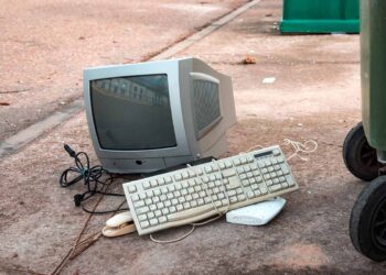 E-scrap items set near a collection bin.
