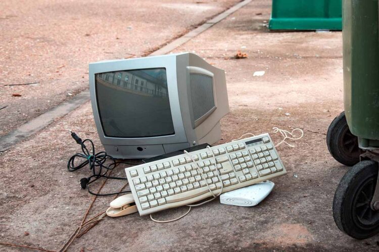 E-scrap items set near a collection bin.