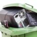 Electronics collected for recycling in a bin.