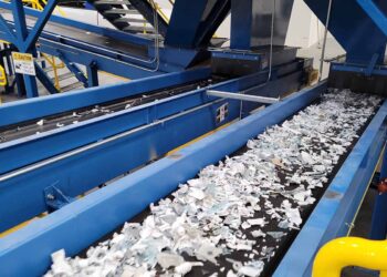 Shredded material on a conveyor at the evTerra Las Vegas facility.