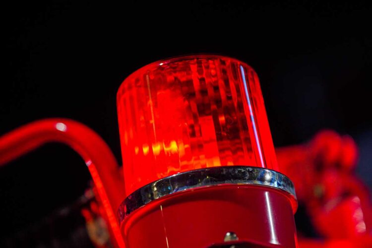 Closeup of firetruck light on truck with black background