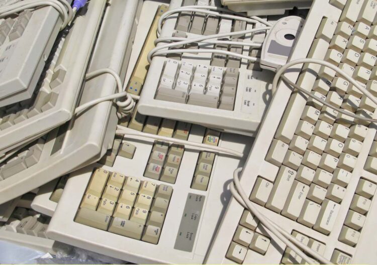 stack of used keyboards