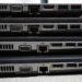 Laptops stacked for resale or recycling.