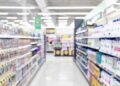 Retail aisle with paper and plastic packaging.
