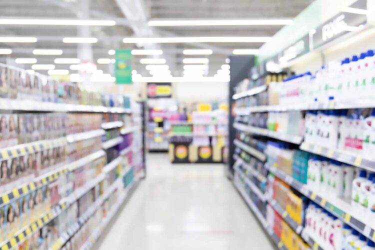 Retail aisle with paper and plastic packaging.