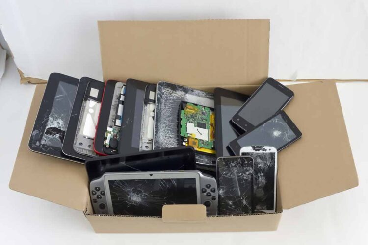 Scrap electronic devices gathered for recycling.