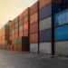 Shipping containers stacked at a logistic hub.