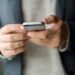 Person with smartphone in their hands.