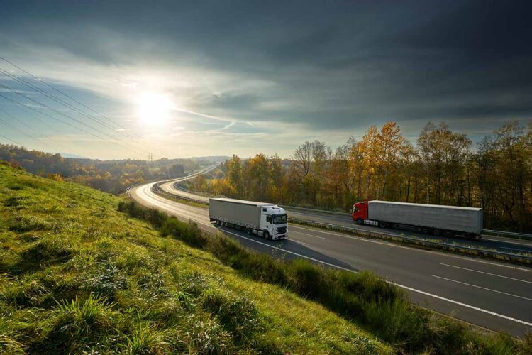 Trucks driving on a highway.
