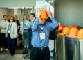 Tour participants were outfitted with hardhats for safety.