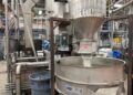 Extruder pushes out natural HDPE pellets at KW Plastics in Troy, Alabama.
